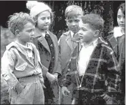 ?? Special to the Democrat-Gazette ?? A young Don Tyson, in the plaid jacket, plays the leader of a gang of children in The Kidnappers Foil, which was filmed in Springdale in 1937. The film was rediscover­ed last year and can now be found at the Library of Congress.