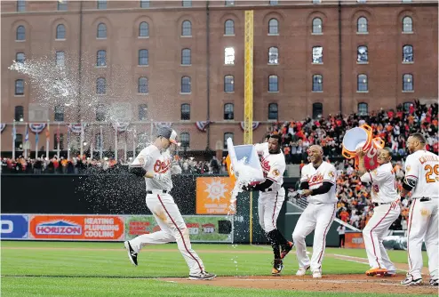  ?? PATRICK SEMANSK / THE ASSOCIATED PRESS ?? Baltimore Orioles slugger Mark Trumbo was the home run king last season and won his team’s first game of this campaign Monday with a walk- off home run, but didn’t get nearly the amount of money as a free agent many expected.