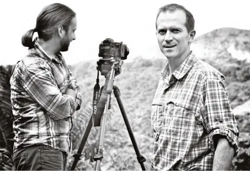  ??  ?? Filmmaker Michael Matheson Miller (right) during the shooting of Pverty Cure