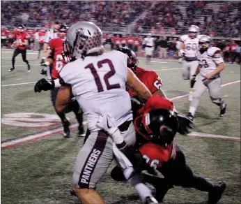  ?? Graham Thomas/Siloam Sunday ?? Siloam Springs junior tight end Chase Chandler is wrapped up by Russellvil­le defenders after catching a pass in the first quarter Friday at Cyclone Stadium.