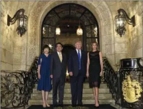  ?? SUSAN WALSH — THE ASSOCIATED PRESS ?? President Donald Trump, second from right, and first lady Melania Trump, right, stop to pose for a photo with Japanese Prime Minister Shinzo Abe, second from left, and his wife Akie Abe, left, before they have dinner at Mar-a-Lago in Palm Beach, Fla.,...
