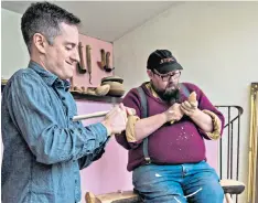  ??  ?? Craftsman: Barnaby Carder (right) teaches at a spoon-carving masterclas­s