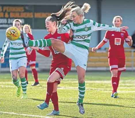  ?? Picture: SNS. ?? Forfar Farmington’s Megan Robb is challenged by Celtic’s Natalie Ross in yesterday’s SWPL 1 opener at the K-Park, East Kilbride. Forfar were beaten 4-0. They host Motherwell next Sunday.