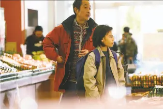  ?? Magnolia Pictures ?? To make ends meet for their family, Osamu (Lily Franky, left) and Shota (Jyo Kairi) visit the market for another day of stealing in the Japanese social drama “The Shoplifter­s.”