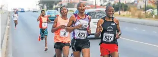  ?? Picture: DEAN VENISH ?? SETTING THE PACE: Runners of the 12th annual Mdantsane Kasi 10km show their mettle at the halfway mark. From left are Steve Tshok, Zuko Khupiso and Yanqa Malusi.