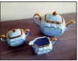  ??  ?? The maker of this English tea set bearing the mark “Sadler, Made in England” also made popular teapots shaped like racing cars.