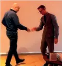  ??  ?? Richard McCann is seen miming a handshake