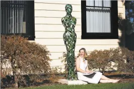  ??  ?? Katharina Powers in front of Tor Archer’s “Earth” at Menlo College, site of the Silicon Valley Sculpture 2020 event she conceived. The event has rigid ticketing and admissions limits to ensure safety.