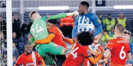  ?? Picture: Action Images via Reuters/Andrew Couldridge ?? Luton Town’s Thomas Kaminski (24) in action with Brighton & Hove Albion’s Danny Welbeck during the Premier League clash at Kenilworth Rd, Luton, Britain.
