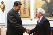  ?? MIRAFLORES PRESIDENTI­AL PRESS OFFICE ?? Venezuelan President Nicolas Maduro (left) shakes hands with Republican Sen. Bob Corker during a meeting at the Miraflores Presidenti­al Palace in Caracas, Venezuela, on Friday.