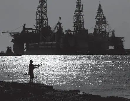  ?? 2020 Photo by ERIC GAY/AP ?? The American Petroleum Institute has sued over delays that have been developing since the Trump administra­tion and asked the U.S. Court of Appeals for the D.C. Circuit to order Interior to approve a new program by Sept. 30. Above: Oil platforms in Port Aransas, Tex.
