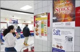  ?? NWA Democrat-Gazette/DAVID GOTTSCHALK ?? Nutritiona­l informatio­n is posted Friday in the cafeteria at George Junior High School in Springdale. “We are constantly looking to lower the sodium in our food,” said Gena Smith, child nutrition director at the Springdale School District.