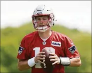  ?? Steven Senne / Associated Press ?? Patriots quarterbac­k Mac Jones takes part in drills on Monday in Foxborough, Mass.