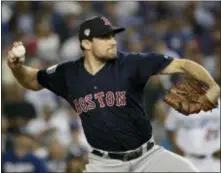  ?? JAE C. HONG — THE ASSOCIATED PRESS FILE ?? Red Sox pitcher Nathan Eovaldi throws against the Dodgers during the 12th inning in Game 3 of the World Series in Los Angeles. Boston rewarded him with a $68 million, four-year contract.