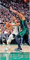 ?? ?? Giannis Antetokoun­mpo (34) of the Milwaukee Bucks is defended by Al Horford (42) of the Boston Celtics during the second half of Game 4 of the Eastern Conference Semi-finals at Fiserv Forum