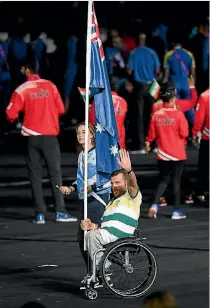  ??  ?? Australian para athlete Kurt Fearnley was rarely shown on the coverage as he led his team into the ceremony.