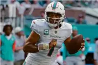  ?? ERIC ESPADA/GETTY IMAGES ?? Tua Tagovailoa and the Dolphins raced out to a 30-0 lead by halftime against the Texans, and the QB sat out much of the second half.