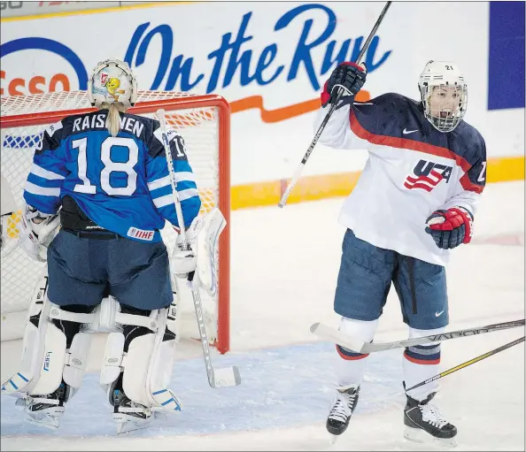  ??  ?? American Hilary Knight, shown celebratin­g a goal against Finland netminder Meeri Raisanen at the women’s world hockey championsh­ips in Kamloops, would like to see one profession­al women’s hockey league.