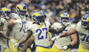  ?? ERIC SMITH/AP ?? LOS ANGELES RAMS RUNNING BACK DARRELL HENDERSON (27) celebrates his touchdown with teammates during the first half of a game against the Houston Texans Sunday in Houston.