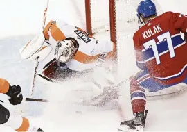  ?? FRANK GUNN/THE CANADIAN PRESS VIA AP ?? Flyers goaltender Carter Hart (79) makes a save on Canadiens defenseman Brett Kulak (77) during the second period on Tuesday.