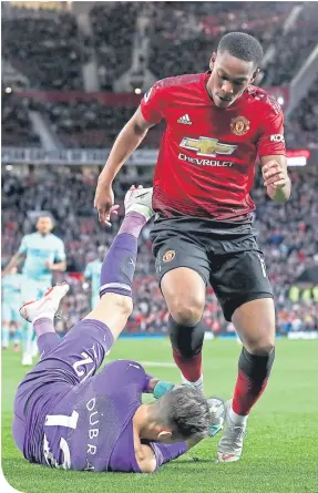  ??  ?? Newcastle’s Martin Dubravka saves at the feet of Anthony Martial