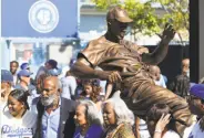  ?? Victor Decolongon / Getty Images ?? David Robinson (son of Jackie, second from left), widow Rachel and daughter Sharon at the unveiling of the Jackie Robinson Statue at Dodger Stadium.