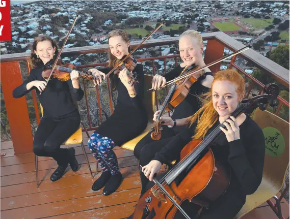  ?? Picture: WESLEY MONTS ?? HIGH CULTURE: Townsville string quartet Ellen Conrad, 16, Lucy Fagez, 17, Aliesha Smith, 17, and Samantha Tibbey, 17, are getting ready for the Australian Festival of Chamber Music with performanc­es on Castle Hill, finishing today.