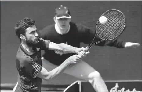  ??  ?? France’s Gilles Simon hits a backhand to American Bjorn Fratangelo during their openingrou­nd match at the Hungarian Open in Budapest on Tuesday. Fratangelo won 6- 4, 6- 1.