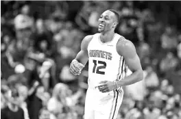  ?? — AFP photo ?? This file photo taken on December 04, 2017 shows Dwight Howard of the Charlotte Hornets react after a play against the Orlando Magic during their game at Spectrum Center in Charlotte, North Carolina.