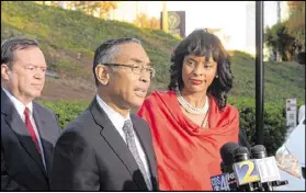  ?? KENT D. JOHNSON / AJC ?? DeKalb CEO Burrell Ellis, with his wife, Philippa, and defense attorney Craig Gillen. A breakdown of Ellis’ legal costs was revealed last week in 152 pages of government records obtained through the Georgia Open Records Act.