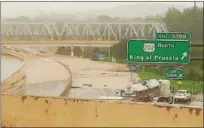  ?? PHOTO COURTESY OF MARK EYER ?? Vehicles are diverted from the westbound lanes of Interstate 76 in King of Prussia while eastbound traffic is stuck at a standstill in the distance during the deluge that resulted in heavy flooding throughout the region Monday morning.