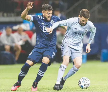  ?? GETTY IMAGES FILES ?? Lucas Cavallini of the Whitecaps, left, seen competing against Ilie Sanchez of Sporting Kansas City in February, has opted out of participat­ing in the MLS Is Back tournament because of concerns about coronaviru­s. Cavallini’s grandmothe­r and great uncle died from COVID-19.