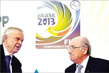  ?? AFP ?? The then president of the organising committee of the 2014 FIFA World Cup, Jose Maria Marin (left), speaks with FIFA’s president Sepp Blatter after a press conference in Rio de Janeiro on July 1, 2013. Marin was jailed for corruption in New York on Wednesday.