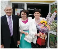  ??  ?? ABOVE:
Principal of School Mary Sugrue presents gifts to Kitty O’Shea and Flor O’Leary at the official opening of Scoil Saidhbhín