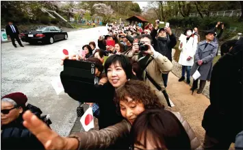  ??  ?? Well-wishers wave to Akihito and Michiko (not in picture) as they visit Kodomonoku­ni in Yokohama, south of Tokyo. — Reuters photo