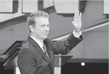  ?? ROBYN BECK, AFP/GETTY IMAGES ?? Rand Paul waves as he takes the stage at the start of the Republican presidenti­al debate Dec. 15 in Las Vegas.