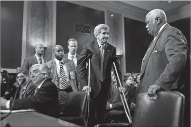  ?? ANDREW HARNIK/AP PHOTO ?? Secretary of State John Kerry, center, Secretary of Energy Ernest Moniz, seated second from left, and Secretary of Treasury Jack Lew, seated left, arrive Thursday to testify at a Senate Foreign Relations Committee hearing on Capitol Hill to review the...