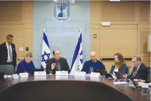  ?? (Olivier Fitoussi/Flash90) ?? RELIGIOUS ZIONIST PARTY MK Simcha Rothman, with legal adviser Gur Bligh on his left, heads a meeting of the Constituti­on Law and Justice Committee at the Knesset yesterday.