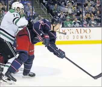  ?? [PAUL VERNON/THE ASSOCIATED PRESS] ?? Jussi Jokinen, right, made his Jackets debut on Thursday against Dallas, just one day after being picked up off waivers.