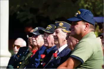  ?? Dan Watson/The Signal (See additional photos at signalscv.com) ?? Veterans from World War II, Korea and Vietnam sit in the crowd at a 2017 Veterans Day ceremony at Veterans Historical Plaza in Newhall. Bella Vida senior center is planning a tribute Nov. 8 at the recently opened facility.