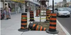  ?? JACK LAKEY/TORONTO STAR ?? Trees on Danforth Ave. have been surrounded by traffic cones for months.