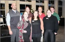  ?? (NWA Democrat-Gazette/Carin Schoppmeye­r) ?? Matt Hickson (from left), Leeanna McKinnie, Lori Walker, Ivy Roberts, Ben Bigger, Leah Neal and Colton Brannan represent Chambers Bank at Single Parent Scholarshi­p Fund of NWA’s annual Jingle Mingle on Dec. 8 at Heroncrest in Springdale.