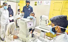  ??  ?? Doctors conduct eye check-up of patients suspected to have been infected with mucormycos­is, at Sarojini Devi Eye Hospital in Hyderabad on Monday.