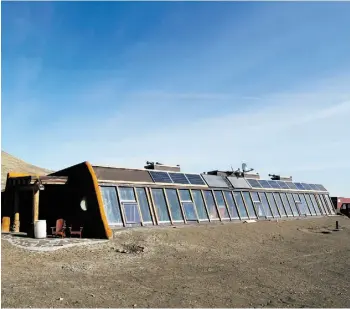  ?? CHRISTINA RYAN/CALGARY HERALD ?? The Kinney family’s “earthship” home north of Lethbridge is a radically sustainabl­e building that features the comforts of a modern home without any electricit­y or water bills.