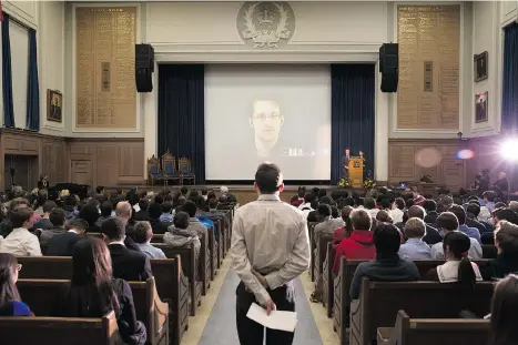  ?? MATTHEW SHERWOOD/POSTMEDIA NEWS ?? Edward Snowden delivers a keynote address via webcam from Russia to students at a world affairs conference in Toronto on Monday.