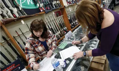  ??  ?? Dukes Sport Shop in New Castle, Pennsylvan­ia, in March. Industry analysts estimate sales of about 3m weapons since March. Photograph: Keith Srakocic/AP