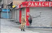  ?? AP ?? A curfew was imposed in Kashmir on Monday, a day after three Hizbul Mujahideen militants were gunned down by the forces.