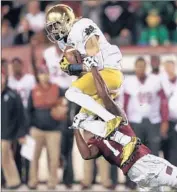  ?? David Maialetti
Associated Press ?? NOTRE DAME’S Will Fuller catches a pass against Temple. The No. 5 Irish are just outside the playoff.