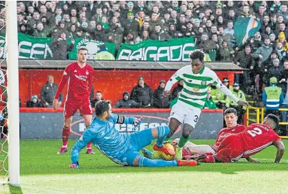  ?? Picture: SNS. ?? Celtic’s Jeremie Frimpong scores to make it 2-0 as the Hoops run riot in the first half.