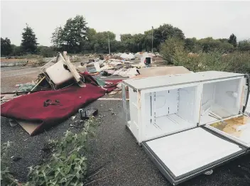  ??  ?? Fly tipping and rubbish dumped on the former B &amp; Q and Matalan site on Station Road East